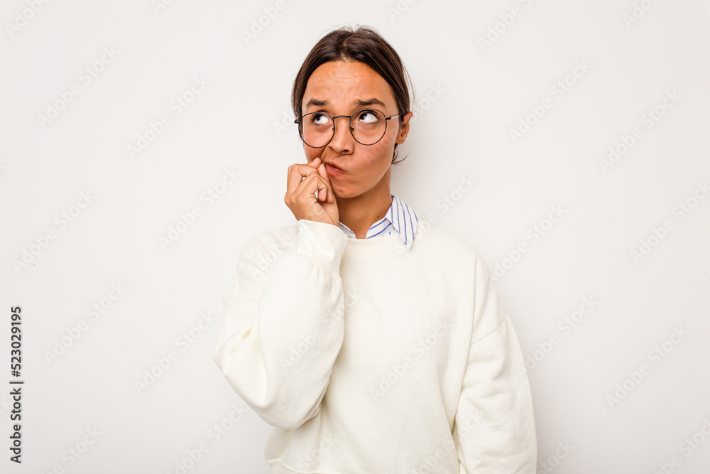Young hispanic woman isolated on white background with fingers on lips keeping a secret. Young hispanic woman isolated on white background with fingers on lips keeping a secret.