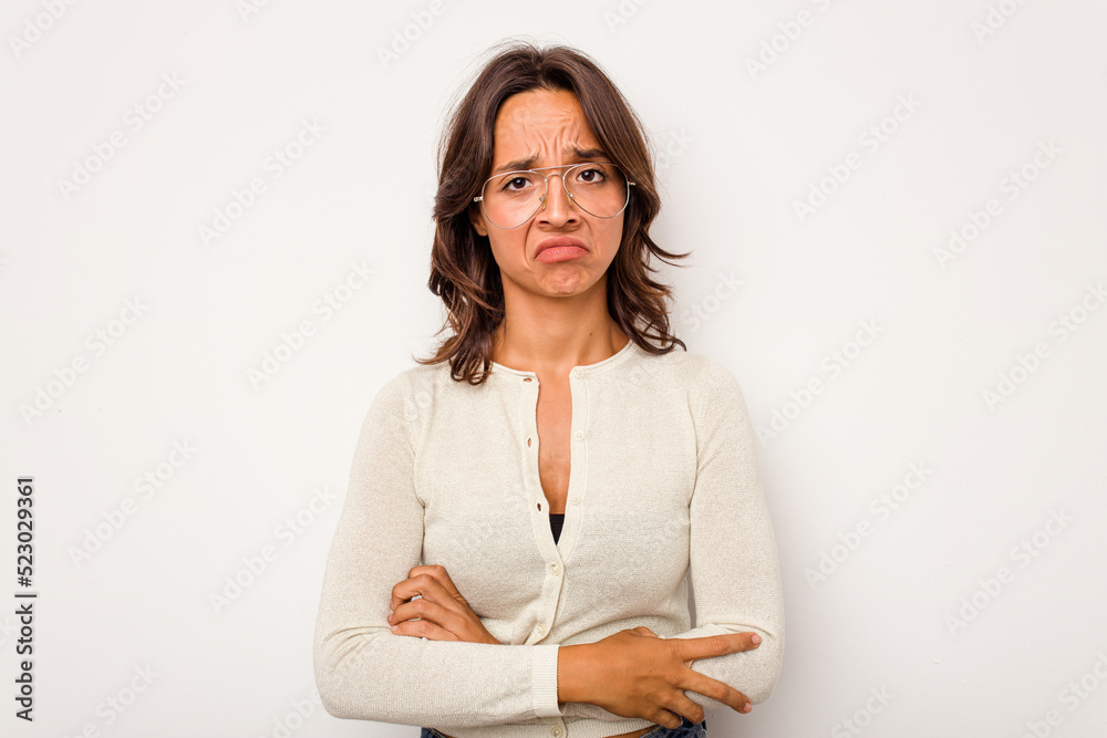 Young hispanic woman isolated on white background unhappy looking in camera with sarcastic expression. Young hispanic woman isolated on white background unhappy looking in camera with sarcastic expression.