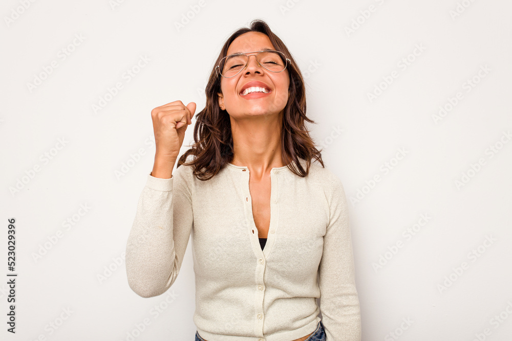 Young hispanic woman isolated on white background celebrating a victory, passion and enthusiasm, happy expression. Young hispanic woman isolated on white background celebrating a victory, passion and enthusiasm, happy expression.