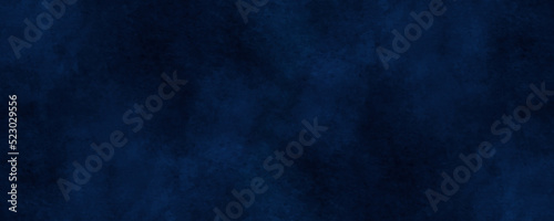 Abstract navy blue blurry and grainy texture, blue grunge texture with colorful blue smoke, decorative and blurry and grunge blue paper texture, Colorful blue textures for making flyer and poster. 