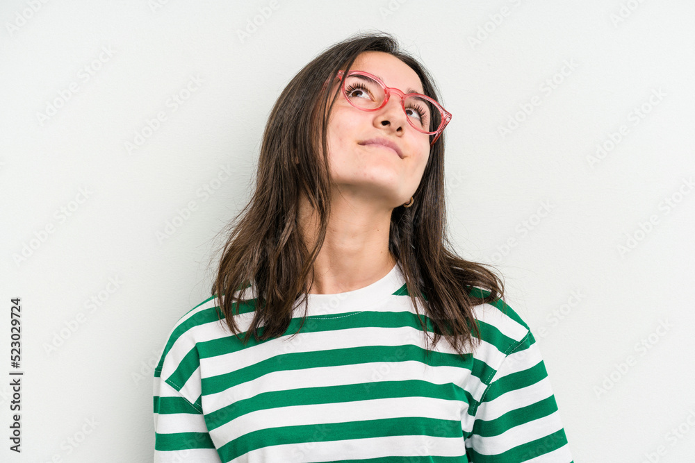 Young caucasian woman wearing a glasses isolated on blue background dreaming of achieving goals and purposes Young caucasian woman wearing a glasses isolated on blue background dreaming of achieving goals and purposes