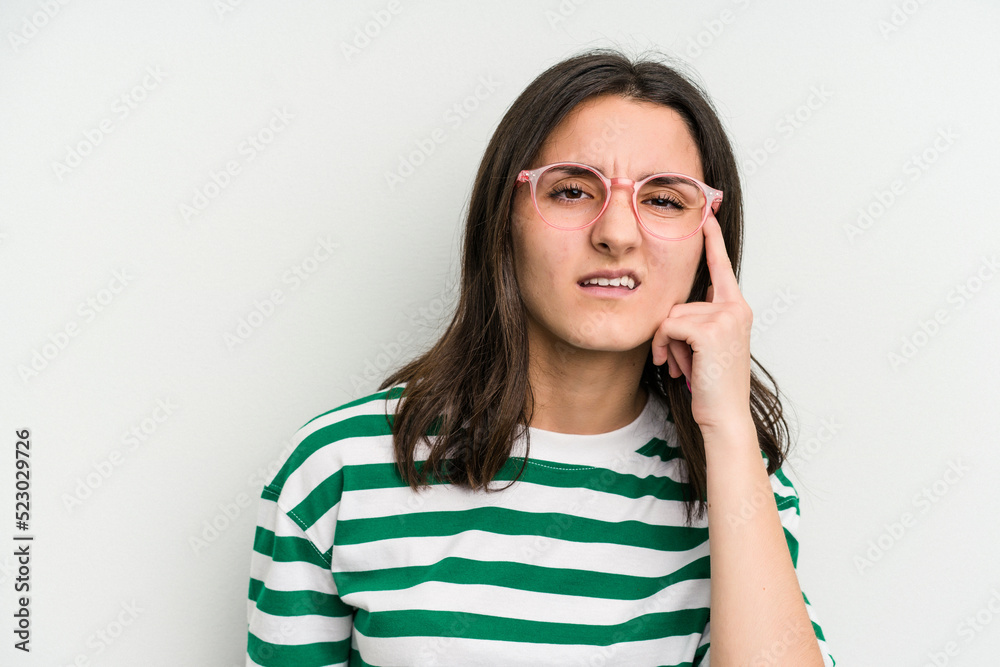 Young caucasian woman wearing a glasses isolated on blue background showing a disappointment gesture with forefinger. Young caucasian woman wearing a glasses isolated on blue background showing a disappointment gesture with forefinger.