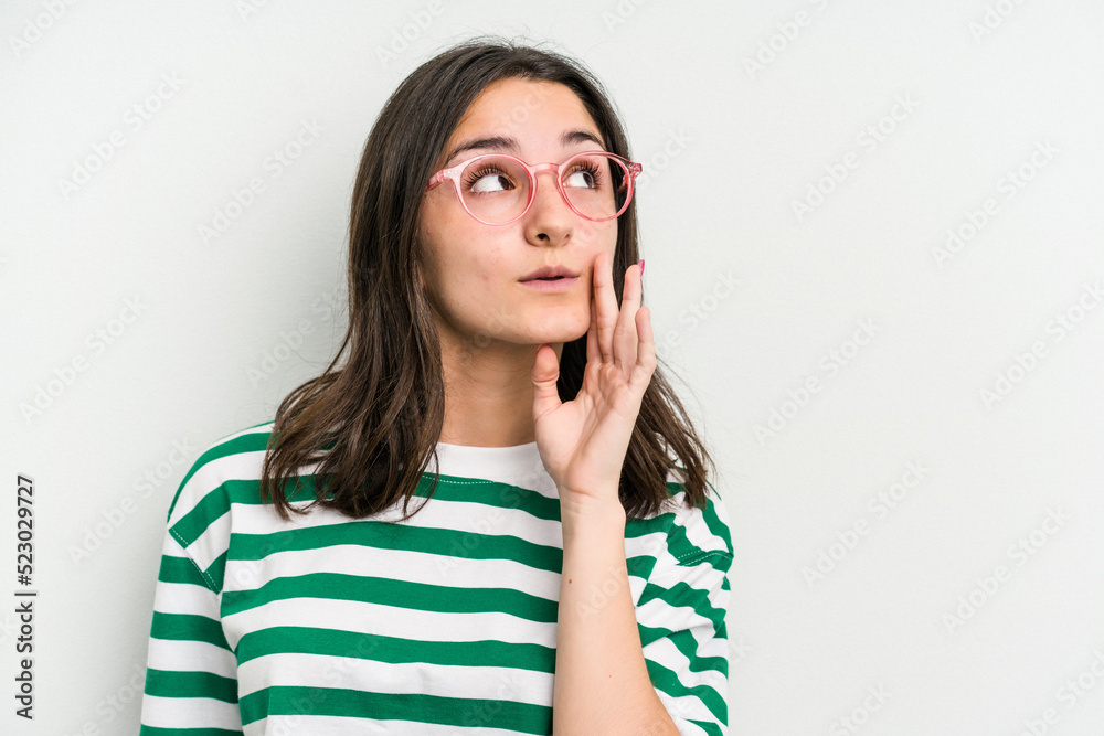 Young caucasian woman wearing a glasses isolated on blue background is saying a secret hot braking news and looking aside Young caucasian woman wearing a glasses isolated on blue background is saying a secret hot braking news and looking aside