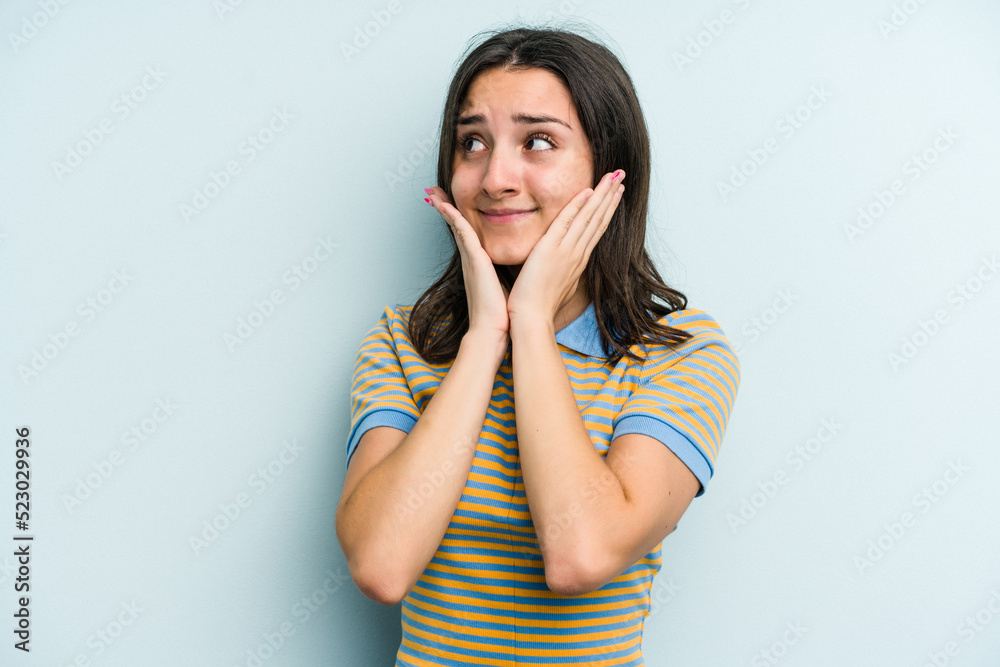 Young caucasian woman isolated on blue background scared and afraid. Young caucasian woman isolated on blue background scared and afraid.