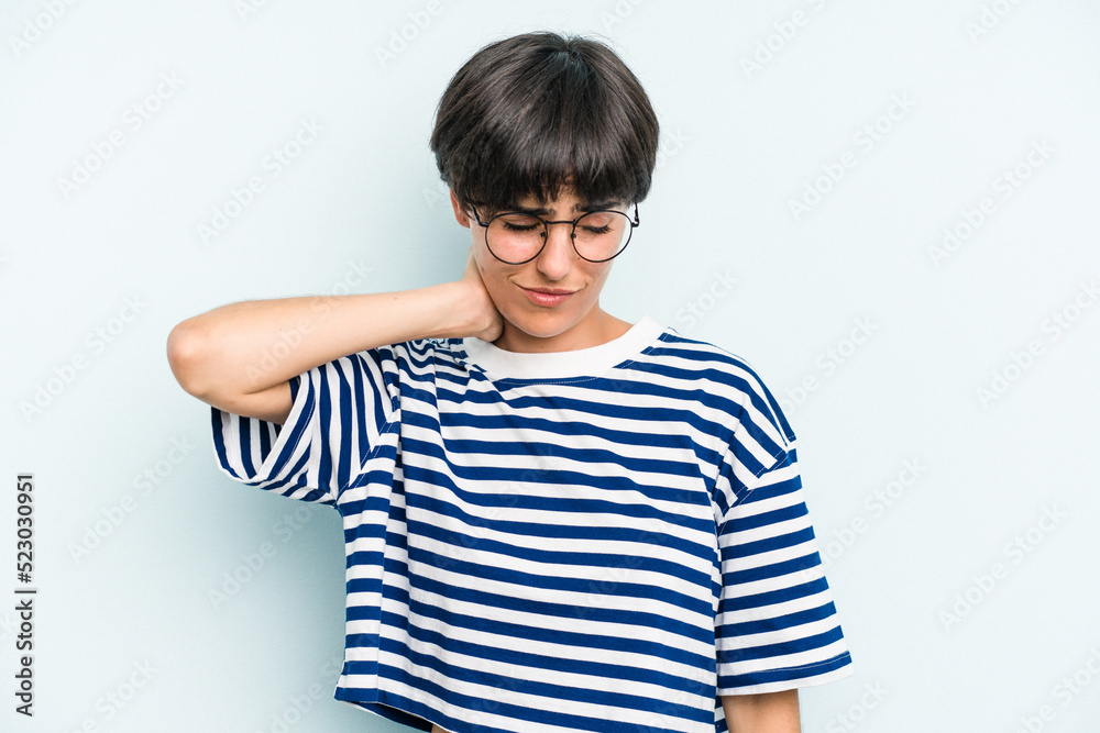 Young caucasian woman with a short hair cut isolated having a neck pain due to stress, massaging and touching it with hand. Young caucasian woman with a short hair cut isolated having a neck pain due to stress, massaging and touching it with hand.