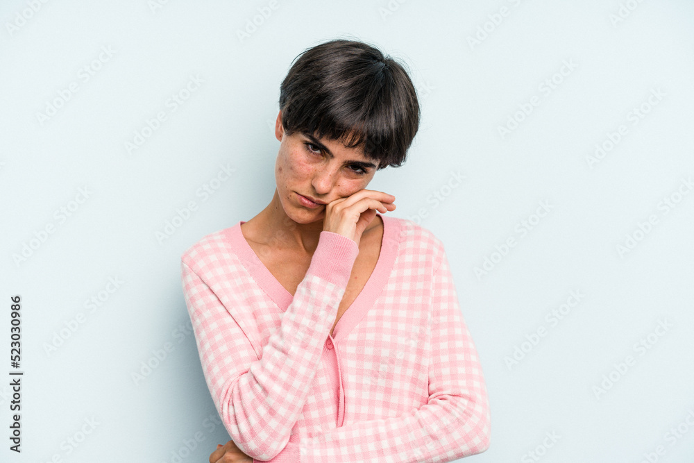 Young caucasian woman with a short hair cut isolated tired of a repetitive task. Young caucasian woman with a short hair cut isolated tired of a repetitive task.