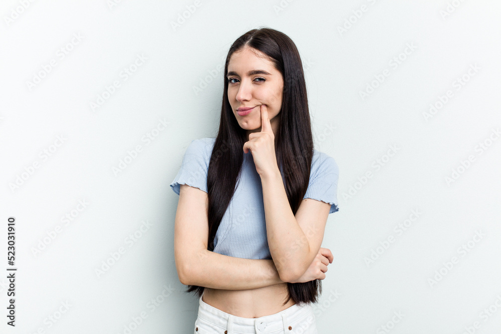 Young caucasian woman isolated on white background contemplating, planning a strategy, thinking about the way of a business. Young caucasian woman isolated on white background contemplating, planning a strategy, thinking about the way of a business.