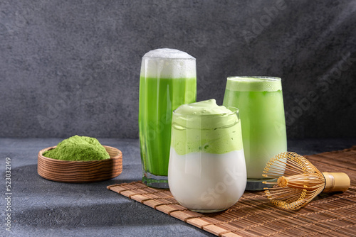 Matcha tea. Iced green tea matcha latte in glass. Green tea dalgona, whipped grean tea with milk. Healthy vegan drink, close up.