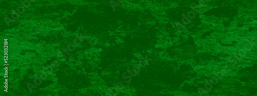 Green abrasive material covered wall background, Green grainy chalkboard or cardboard texture, An old green grunge texture, ancient green stone marble texture with splash ink stripe and scratches. 