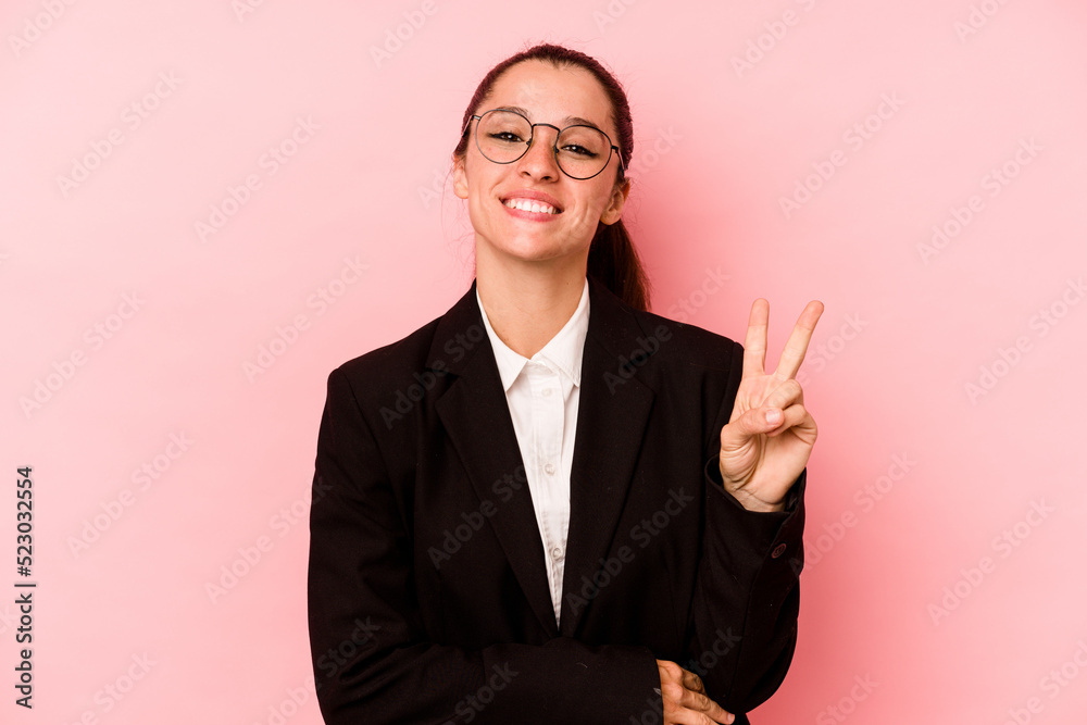 Young business caucasian woman isolated on pink background showing number two with fingers. Young business caucasian woman isolated on pink background showing number two with fingers.