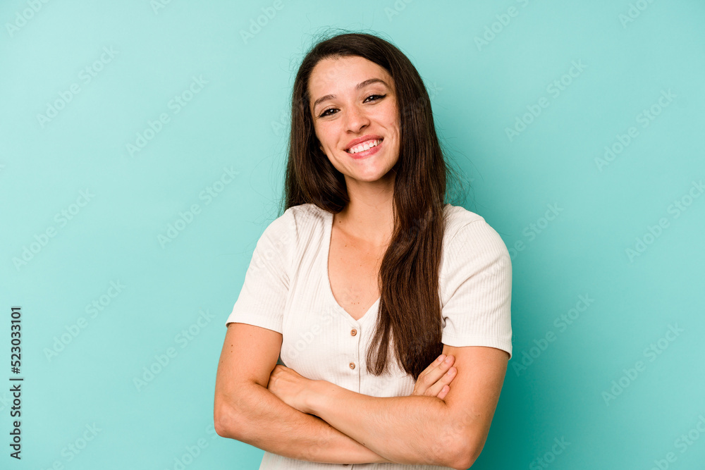 Young caucasian woman isolated on blue background happy, smiling and cheerful. Young caucasian woman isolated on blue background happy, smiling and cheerful.