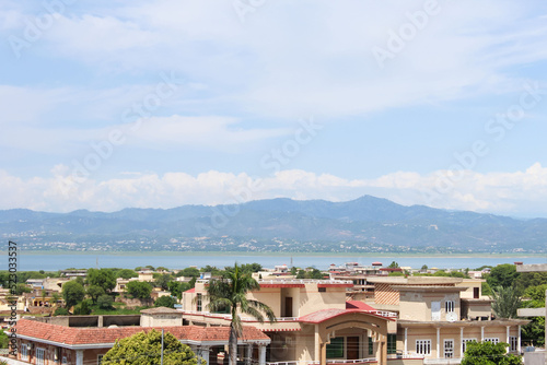 Beautiful Mountains behind the city and river, Skyline view shot