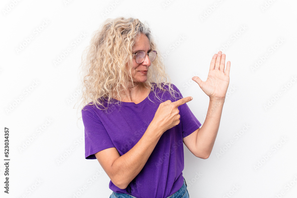 Middle age caucasian woman isolated on white background smiling cheerful showing number five with fingers. Middle age caucasian woman isolated on white background smiling cheerful showing number five with fingers.