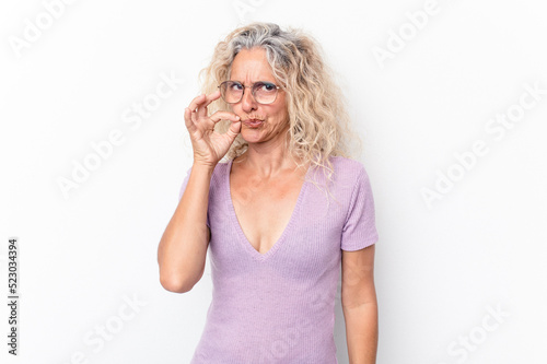 Middle age caucasian woman isolated on white background with fingers on lips keeping a secret.