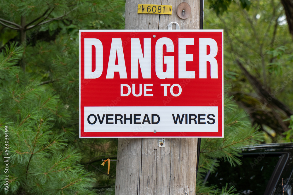 Danger due to overhead wires sign