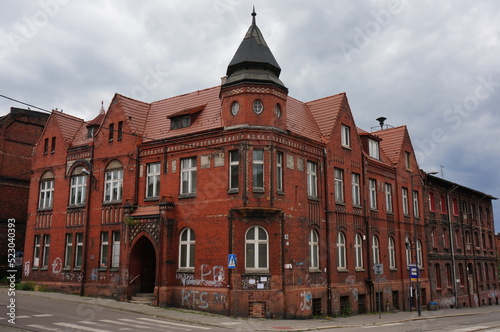 Chropaczow Ratusz. Former Town Hall in the neo-gothic style in Chropaczow district. The corner of the historic building is accentuated octagonal turret. Swietochlowice, Poland.