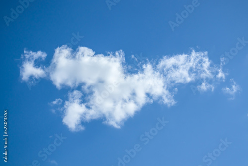 White cloud against the blue sky. Template for wallpaper, stretch ceilings