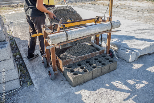 Production of concrete blocks for construction in a handicraft way. Construction cinder blocks.