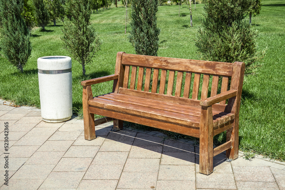 Bench in the park in spring.Landscape. Bench in the park in spring.Landscape.