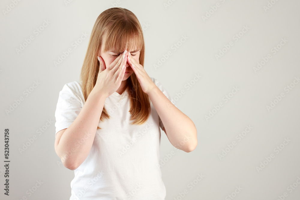 woman has nose pain on a white background woman has nose pain on a white background