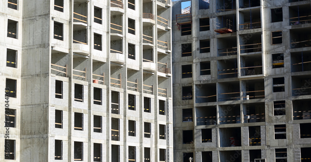 Fototapeta premium Facade of a new modern apartment building under construction, Oktyabrskaya Embankment, St. Petersburg, Russia, August 2022