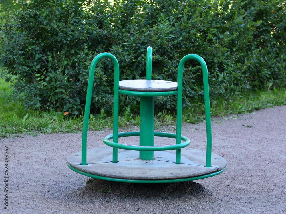 Children's carousel on the playground in the yard Children's carousel on the playground in the yard