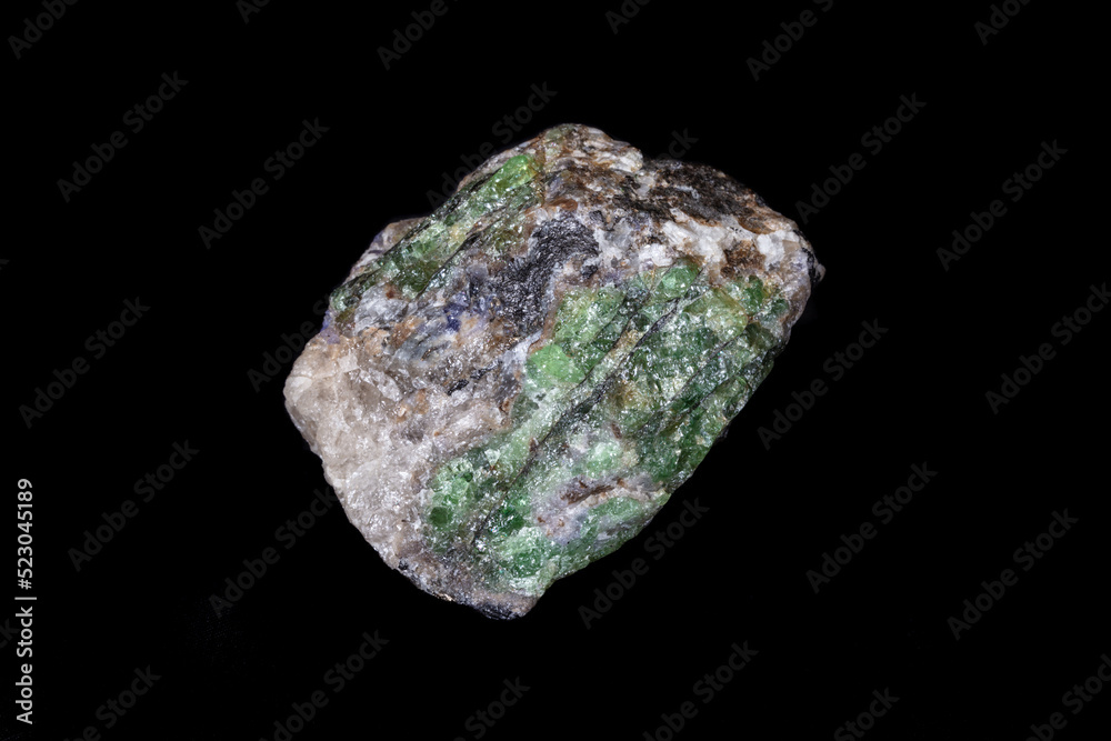 Green Tsavorite garnet, rough samples on host rock from Tanzania. Total specimen weight 142 grams. Black background.
Green Tsavorite garnet, rough samples on host rock from Tanzania. Total specimen weight 142 grams. Black background.