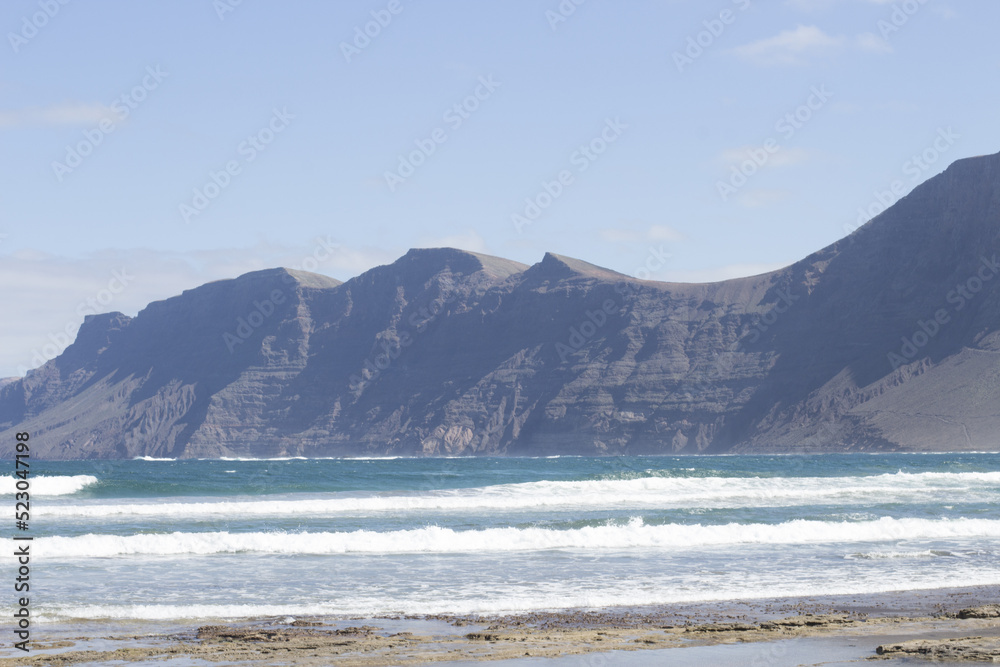 Famara Beach, surfing beach in Lanzarote, Canary Islands, Spain Famara Beach, surfing beach in Lanzarote, Canary Islands, Spain