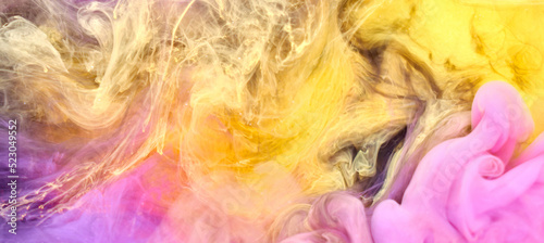 Multicolored yellow pink smoke abstract background, acrylic paint underwater explosion