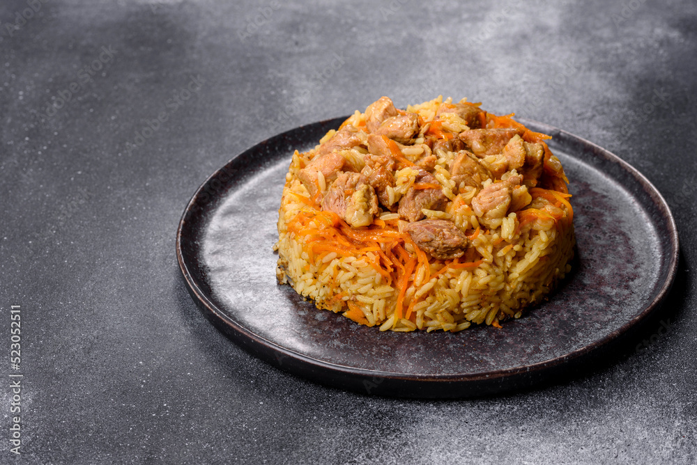 Pilaf or pilau with chicken, traditional uzbek hot dish of boiled rice and chicken meat Pilaf or pilau with chicken, traditional uzbek hot dish of boiled rice and chicken meat