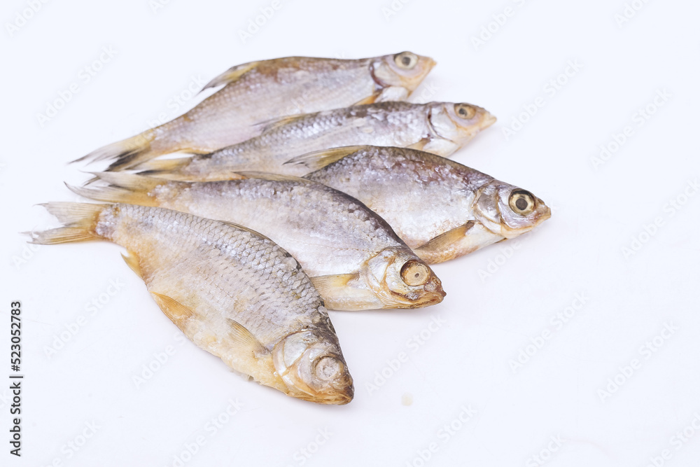 isolated closeup top view dried salted roach fish on white background isolated closeup top view dried salted roach fish on white background