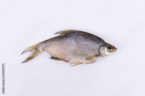 Fototapeta Naklejka Na Ścianę i Meble -  isolated closeup top view dried salted roach fish on white background