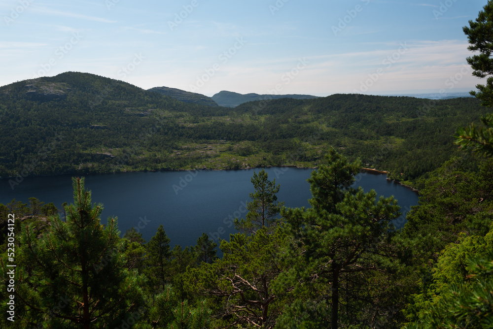Clear mirror-like mountain lake in the area around Pulpit Rock (Preikestolen), Savanger, Norway Clear mirror-like mountain lake in the area around Pulpit Rock (Preikestolen), Savanger, Norway