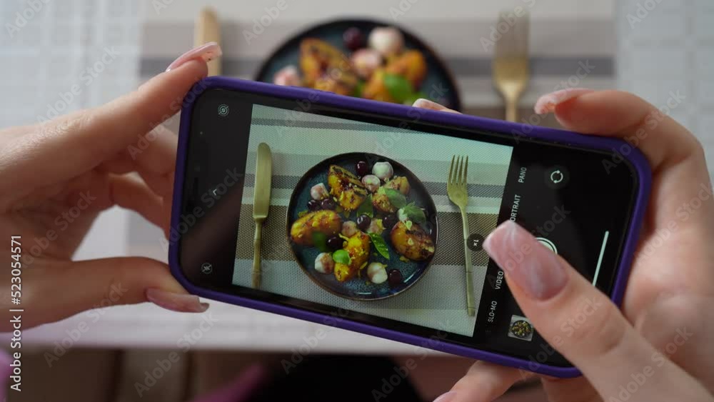 Girl take pictures of grilled peach salad with mozzarella, using smartphone. Female hands take photos of food by modern smartphone. Close up, 4K Girl take pictures of grilled peach salad with mozzarella, using smartphone. Female hands take photos of food by modern smartphone. Close up, 4K