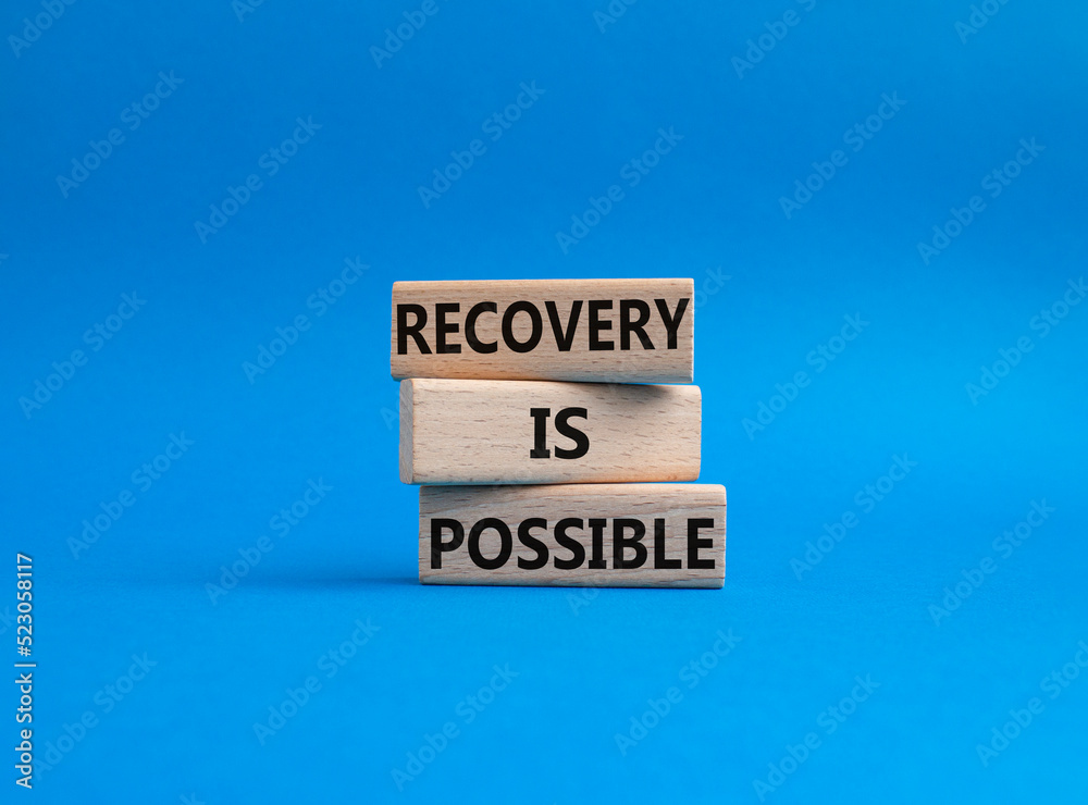 Recovery is possible symbol. Concept words Recovery is possible on wooden blocks. Beautiful blue background. Business and Recovery is possible concept. Copy space. Recovery is possible symbol. Concept words Recovery is possible on wooden blocks. Beautiful blue background. Business and Recovery is possible concept. Copy space.