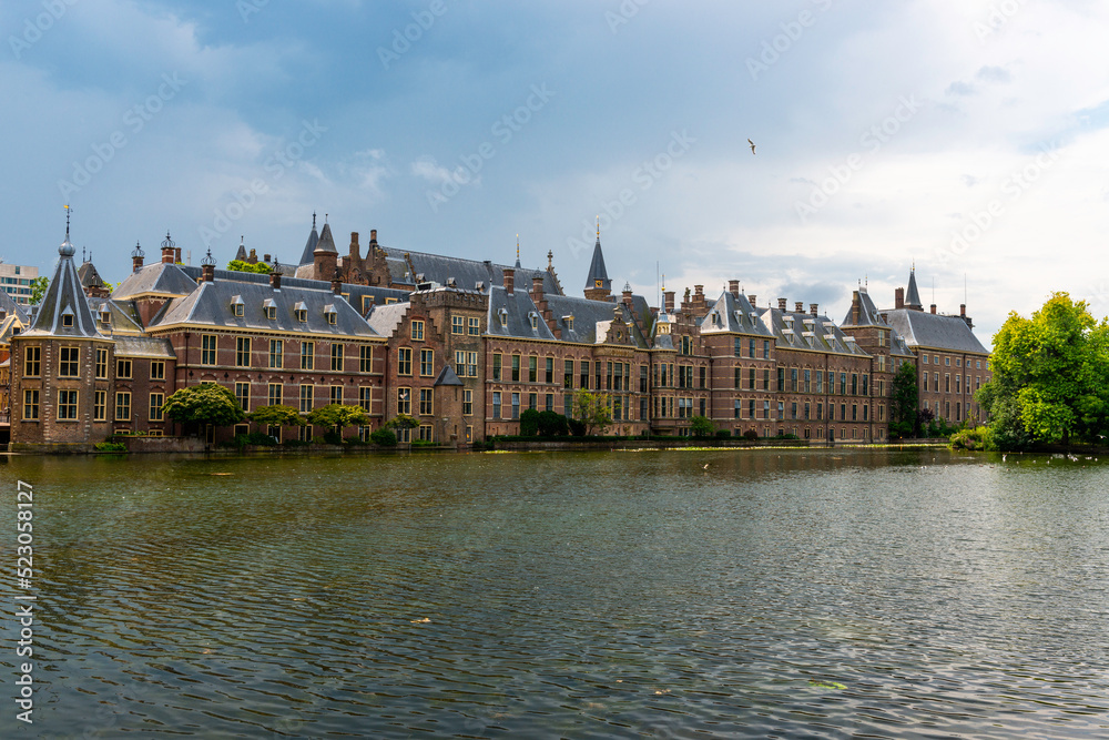 Binnenhof building and The Hague city reflected on the pond.