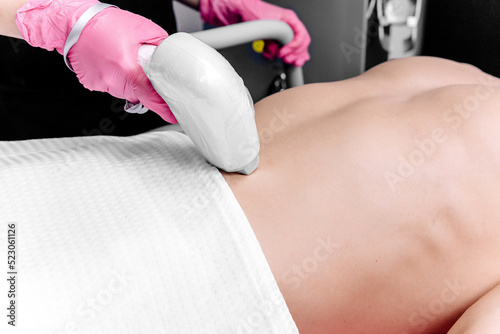 Removal of excess hair in the bikini area or the abdomen of a man. Laser hair removal procedure in a beauty salon. Body care. White underpants