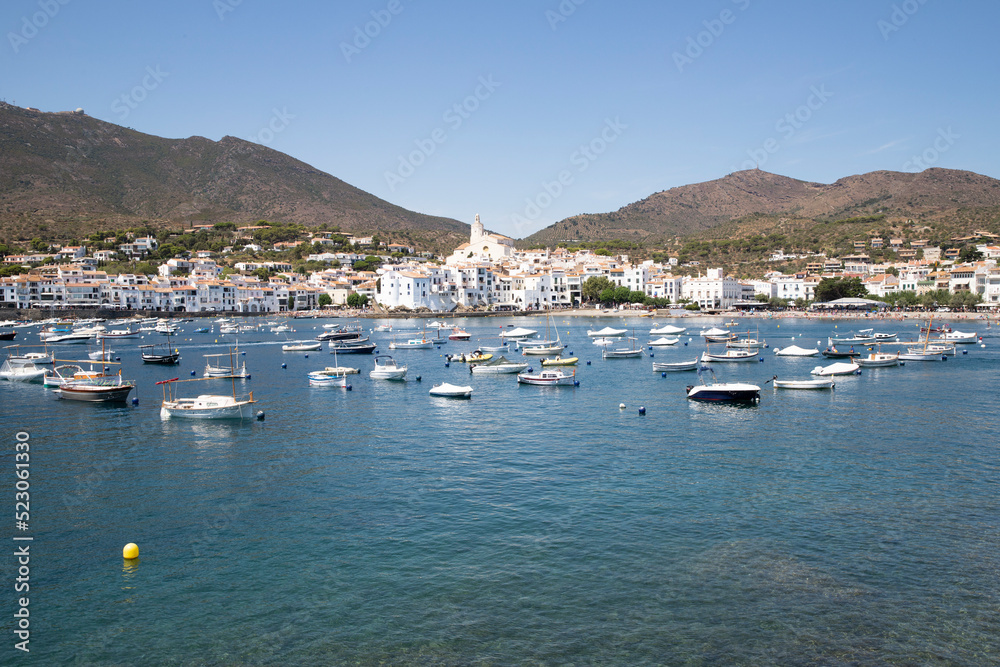 Sea coast of Spain, the city of Cadaqués. Panoramic view of mountains and sea with yachts. Travel postcard