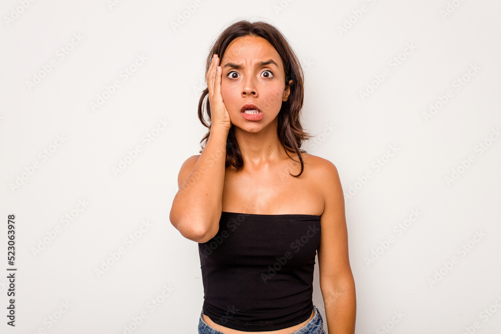 Young hispanic woman isolated on white background being shocked, she has remembered important meeting. Young hispanic woman isolated on white background being shocked, she has remembered important meeting.