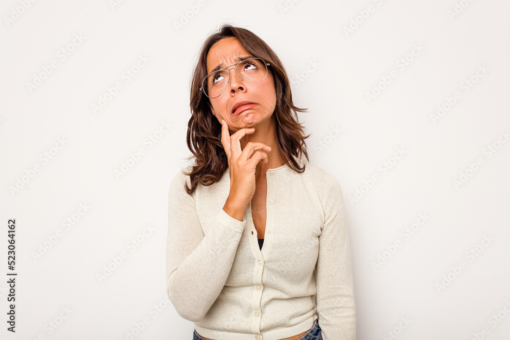 Young hispanic woman isolated on white background crying, unhappy with something, agony and confusion concept. Young hispanic woman isolated on white background crying, unhappy with something, agony and confusion concept.