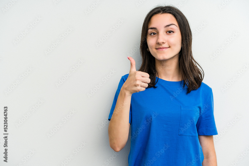 Young caucasian woman isolated on white background smiling and raising thumb up Young caucasian woman isolated on white background smiling and raising thumb up