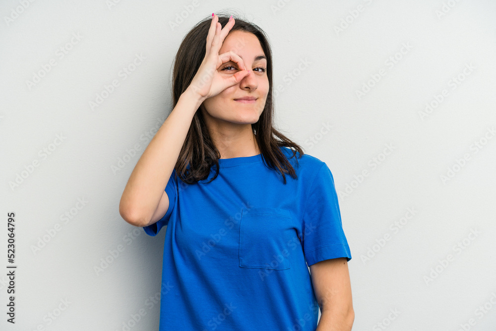 Young caucasian woman isolated on white background excited keeping ok gesture on eye. Young caucasian woman isolated on white background excited keeping ok gesture on eye.