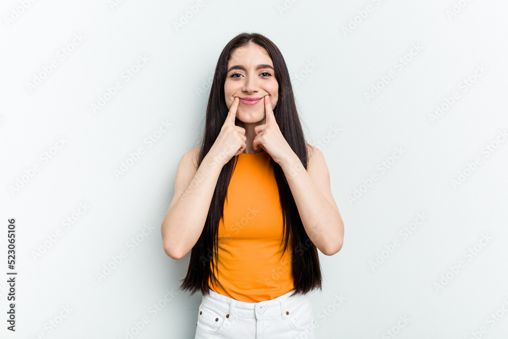 Young caucasian woman isolated on white background doubting between two options. Young caucasian woman isolated on white background doubting between two options.