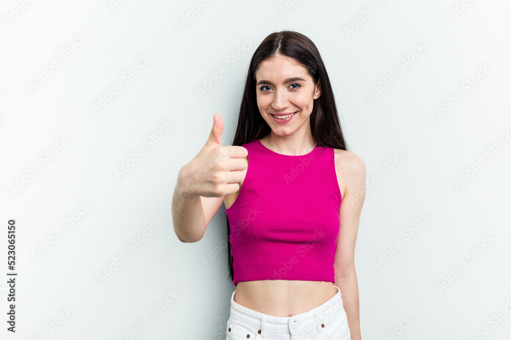 Young caucasian woman isolated on white background smiling and raising thumb up Young caucasian woman isolated on white background smiling and raising thumb up