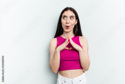 Young caucasian woman isolated on white background making up plan in mind, setting up an idea.