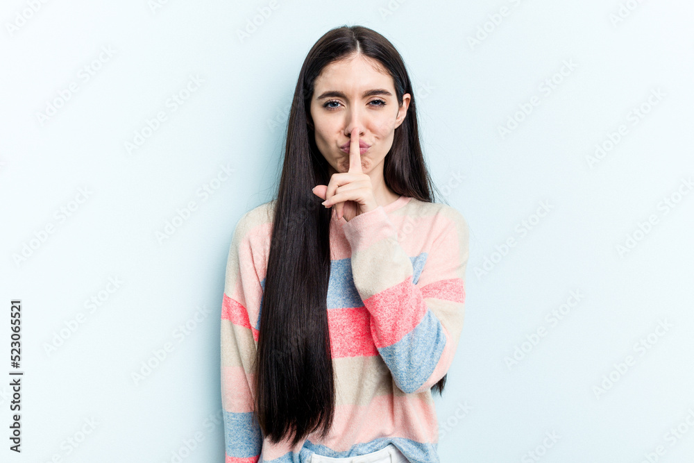 Young caucasian woman isolated on blue background thinking and looking up, being reflective, contemplating, having a fantasy. Young caucasian woman isolated on blue background thinking and looking up, being reflective, contemplating, having a fantasy.