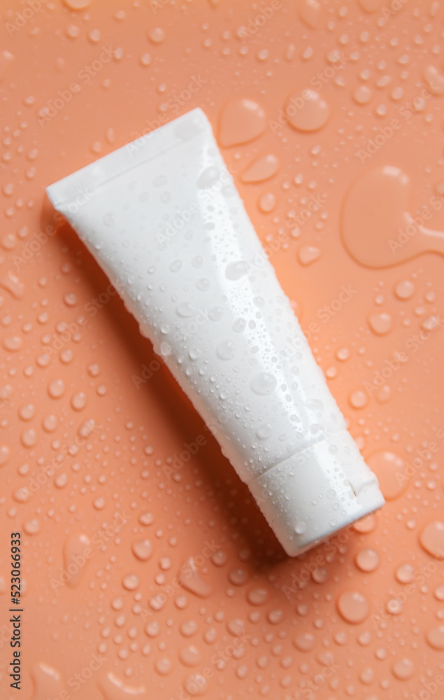 Obraz premium Moisturizing cosmetics on a wet background. Selective focus.