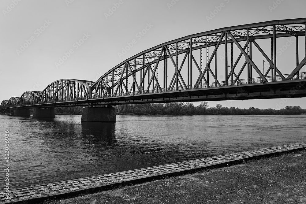 The Vistula River and the steel structure of the road bridge in the city of Torun