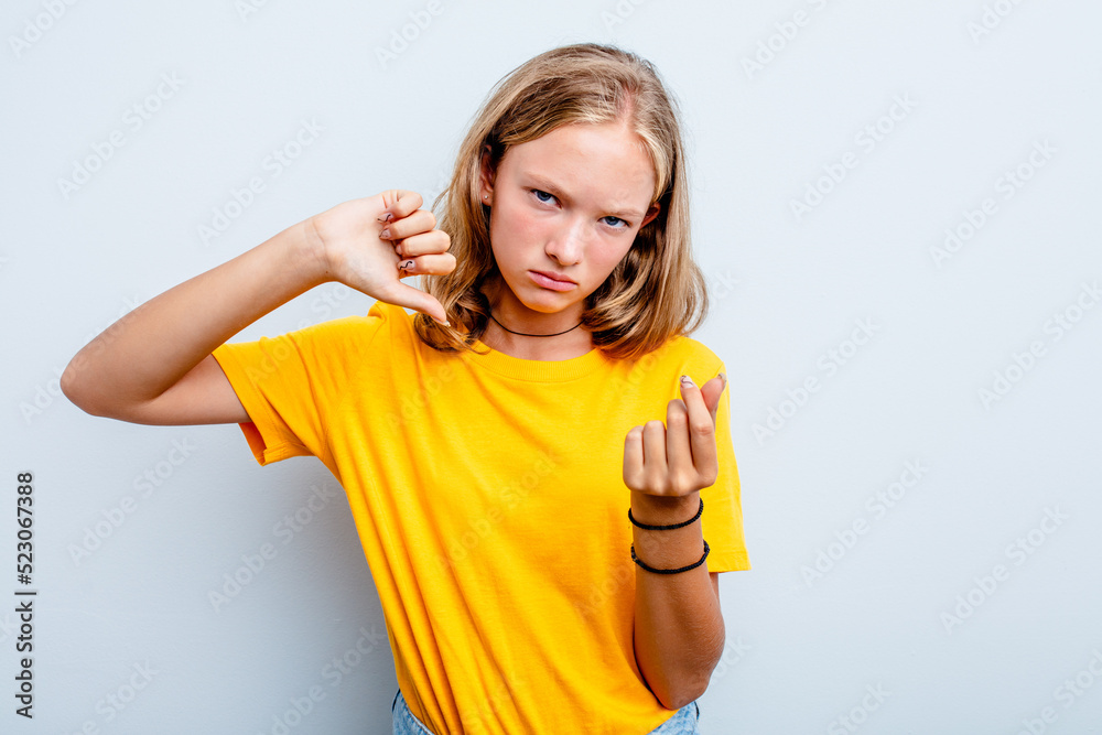 Caucasian teen girl isolated on blue background showing that she has no money. Caucasian teen girl isolated on blue background showing that she has no money.