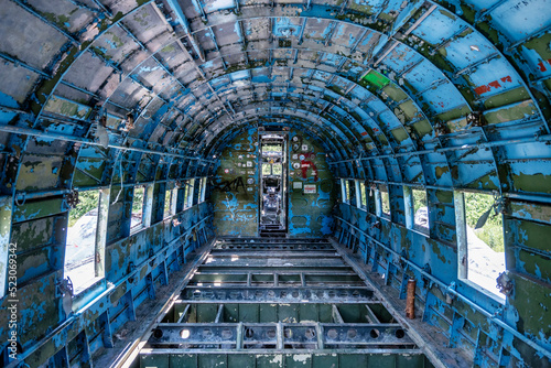 Old, rusty Douglas C 47 aeroplane interior in abandoned military airbase of Zeljava, Croatia